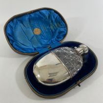 A good quality Victorian cut glass hip flask with silver hunting twist top and silver cup.