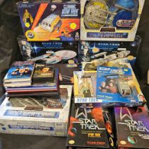 Collection of 11 boxed Star Trek items together with a few books and cassettes Wear and losses to