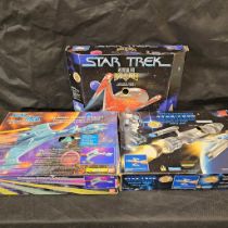 3 boxed Star Trek vehicles, some wear throughout