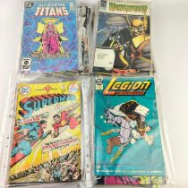 Collection of 43 DC comics including Superman, Tales of the Teen, Titans, Atari Force & Hawk World