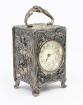 An Edwardian silver carriage clock, having elaborate chased and embossed Art Nouveau floral