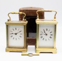 A late 19th Century French brass carriage clock in travel case along with a later brass carriage