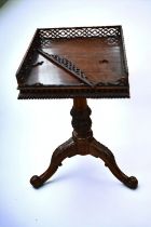 A Victorian galleried mahogany wine table on three splayed feet, one side of gallery broken.