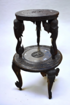 Two similar 20th century Indian carved wooden three Elephant designed legged tables. (2)
