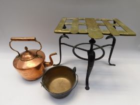 A 19th Century cast iron trivet copper kettle and a small brass jam pan.