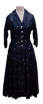 A 1956 silk dress by Cohen & Goshin New York in midnight/navy blue with cream spots in the New