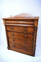 A late Victorian tall mahogany chest of drawers with top secret drawer, barley twist supports,