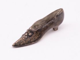 An Edwardian silver novelty pin cushion in the shape of a shoe, hallmarked by Levi & Salaman,