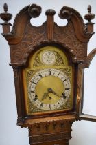 A 20th century Tempus Fugit grand mother clock, with mahogany case and with pendelum weight and key.