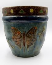 A 20th century Belgian pottery drip glazed jardiniere, having relief triangle and circle design,