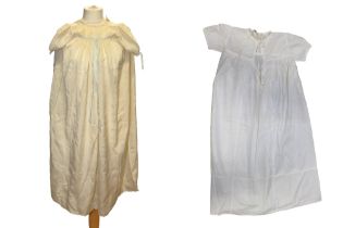 An early 1920s christening robe, lace bib with pale blue ribbon through, short puff sleeves with
