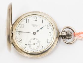 A Waltham silver cased half hunter pocket watch, comprisng a signed white enamel dial with Arabic