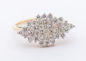 A diamond and 9ct gold cluster ring, comprising a marquise shaped setting, set to the centre with