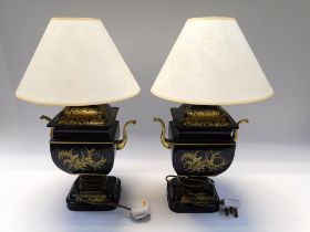 A pair of 20th century metal lamps with painted gold detail - floral, foliage etc. With shades.