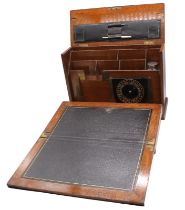 An Edwardian writing box with fold-out leather-bound slope, letter holders, calendar detail, inkwell