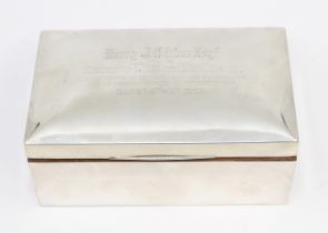 An Edwardian silver rectangular cigarette box, presentation inscription to top, cedarwood interior