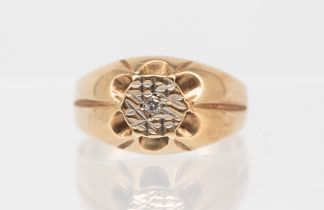 A gents illusion set 9ct gold signet ring, set with a small diamond within a textured surround, size