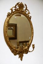 A Regency gesso mirror of ornate design with later Victorian glass, small losses,  approx 100 x