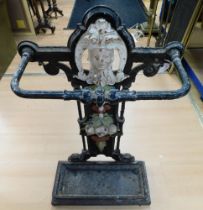 An antique Art Nouveau cast iron stick stand with central painted decorative design. Height 74cm,