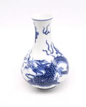 A modern reproduction Chinese blue and white vase, with five claw dragon, circular character mark to