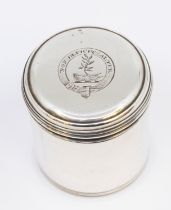 A George III cylindrical silver pyx box, engraved with crest within banner motto: Non Deficit Alter,