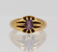 An amethyst and 18ct gold set ring, comprising a oval claw set amethyst, size O, total gross