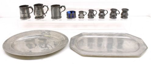 A collection of early or later 19th century pewter items to include; five small graduating
