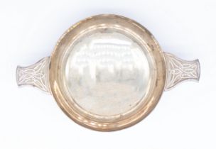 A Modern Irish silver quaich, having twin stylised knot design to handles, circular angled footed
