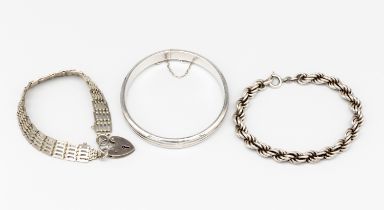A hallmarked silver bracelet, heart shaped lock, a 925 silver rope twist bracelet and a 925 silver