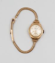 A ladies vintage Accurist 9ct gold wristwatch, comprising a round signed silvered dial with