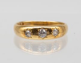 A diamond and 18ct gold ring, set with three graduated old cut diamonds, size Q, total gross