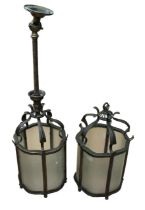 Two late 19th century brass hanging hall lanterns, with frosted glass panels and one with hanging