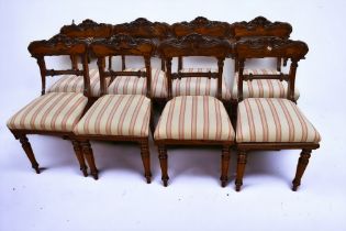 A set of eight reproduction mahogany George III dining chairs.