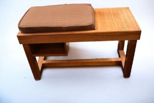 A G plan teak hall telephone table along with a teak magazine rack.