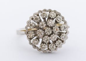 A diamond and 18ct white gold cluster ring, circular design set with small diamonds, diameter approx