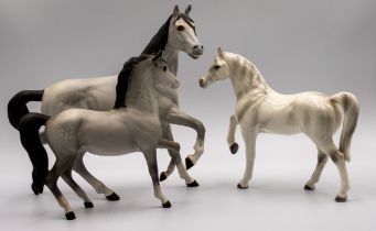 A collection of Beswick and other horses to include; a Jockey on horseback, one Beswick larger