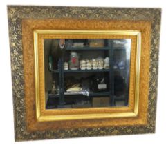 A ornate gilt deeply framed mirror with gold outer frame and bark & ivy leaf design frame. 72cm x 65