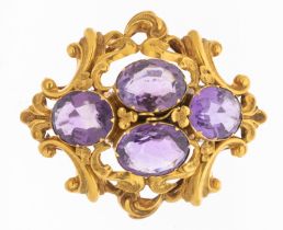 A Victorian amethyst and gold brooch, comprising four oval mixed cut amethysts within a border of