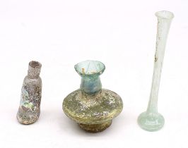Three pieces of Roman style funeral/grave offering glass pieces to include: a long green glass