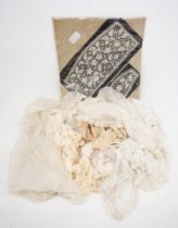 A collection of lace to include a lace and tulle christening veil 1900s, a long lace piece used as a