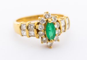 An emerald and diamond 18ct gold oval cluster ring, comprising a caw set marquise cut emerald approx