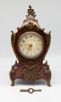 A stunning antique French boulle mantle clock, red tortoise shell with ormolu detail in gilt, with