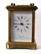 A 20th century Bornand Freres brass cased carriage clock with key, glass panelled sides and door