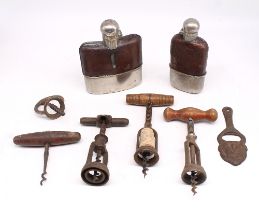 Two antique leather covered hip flasks and a quantity of corkscrews and bottle openers.