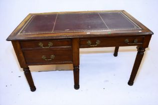 A late Victorian mahogany desk with two side drawers, one single side lap drawer, ox blood writing