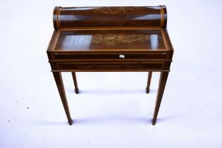A petite Edwardian mahogany ladies desk pull out frieze drawer with mechanism opening top to