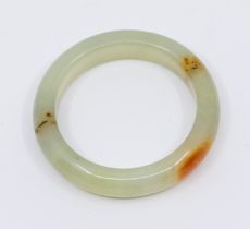 A nephrite jade bangle, D section, width approx 15mm, internal diameter approx 58mm, total weight