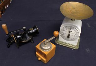 Ceramic Salter family scales on metal base along with two vintage coffee bean grinders.