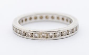 A diamond and platinum full eternity ring, comprising a rows of round brilliant cut diamonds, each