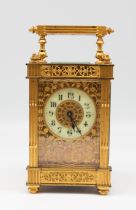 A late 19th/early 20th century probably Continental gilt brass filigree cased carriage clock, no